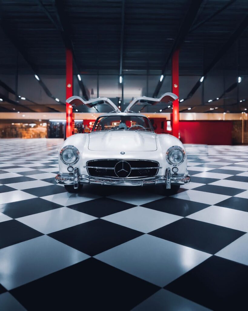 Top 10 Cars with Gullwing Doors 2 A classic Mercedes Benz Gullwing displayed in an elegant showroom in İzmir, Türkiye.