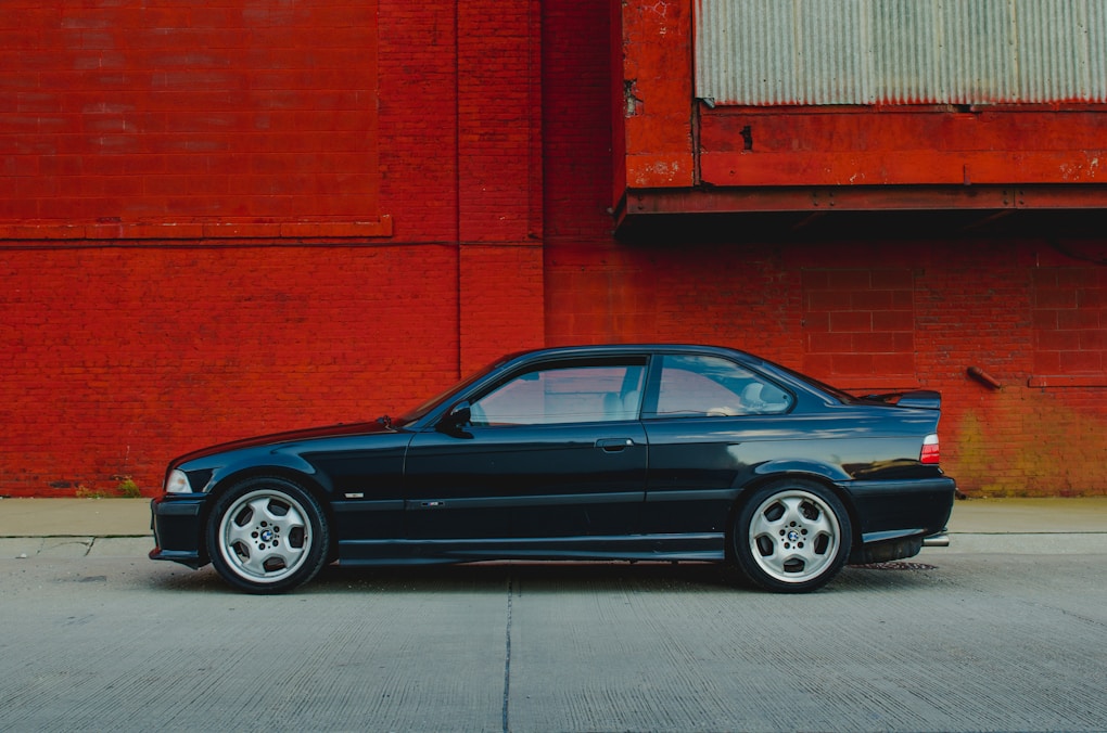 BMW 3 Series E36: The Last Cheap RWD Manual BMW Worth Buying? 1 blue BMW E36 coupe parked
