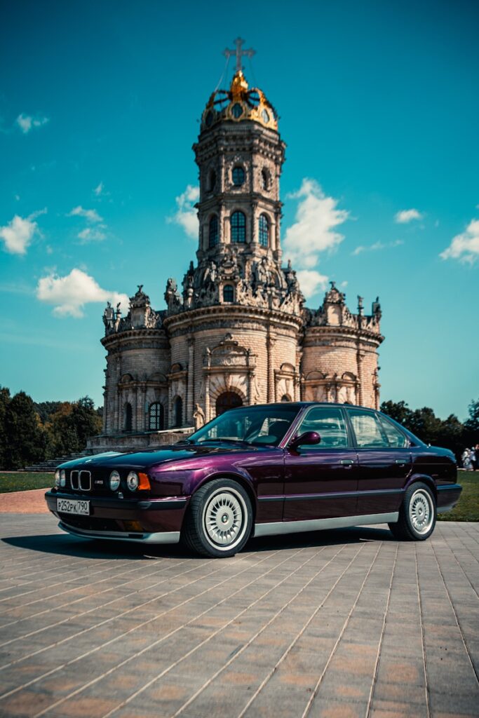 BMW M5 E34: The Hand-Built M5 1 Purple BMW E34 M5, parked next to a Church