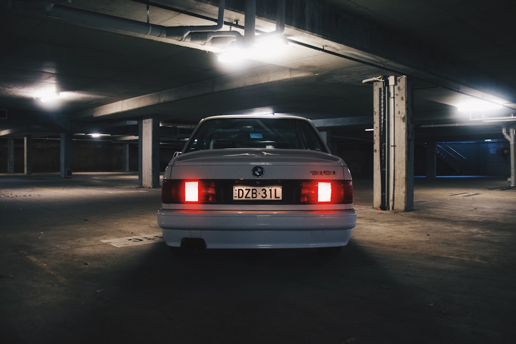 BMW 3 Series E30: Why Everyone Wants One for Their First Project Car 1 white BMW E30 shot from the back