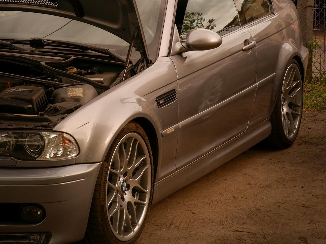 Why the BMW E46 M3 Is a Terrible First Enthusiast Car 5 Silver BMW E46 M3 sports car parked with hood open