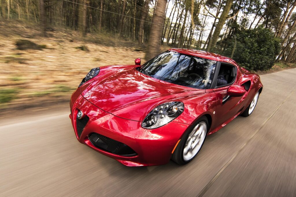 Why the Rare Alfa Romeo 4C Is Steadily Climbing in Value 3 Red alfa romeo 4c driving on back roads