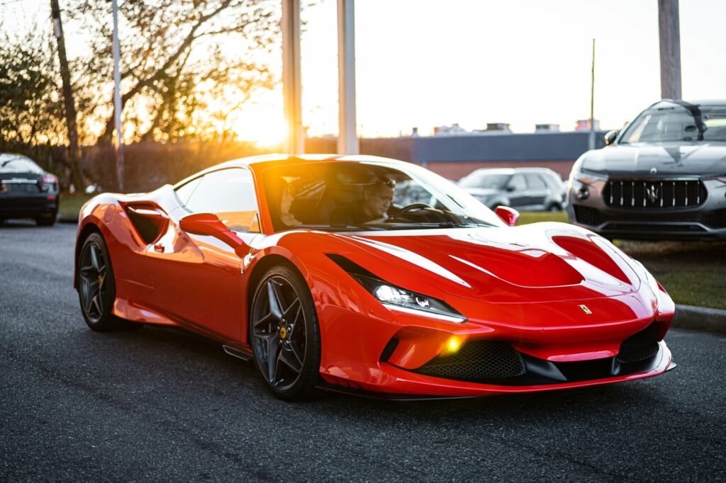 Why Do So Many Supercars Randomly Catch Fire? 2 red ferrari 458 italia on road during daytime