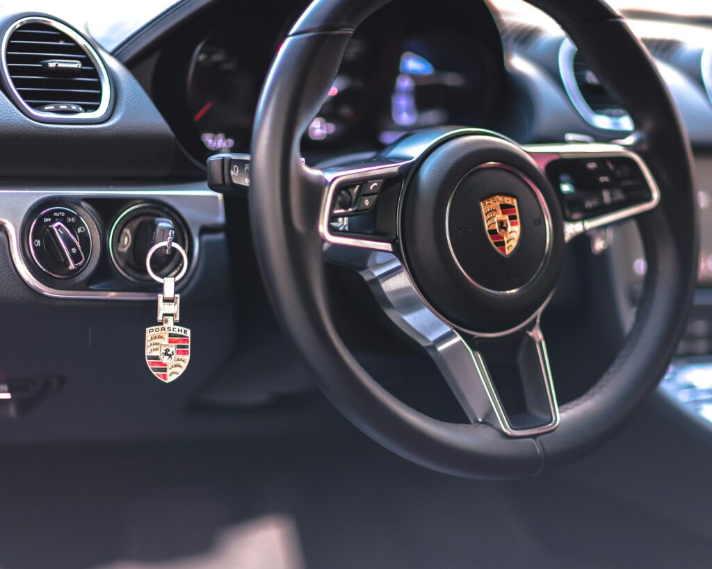 Porsche maintains their signature "old-school" look with physical key-slot on the left side of the steering wheel