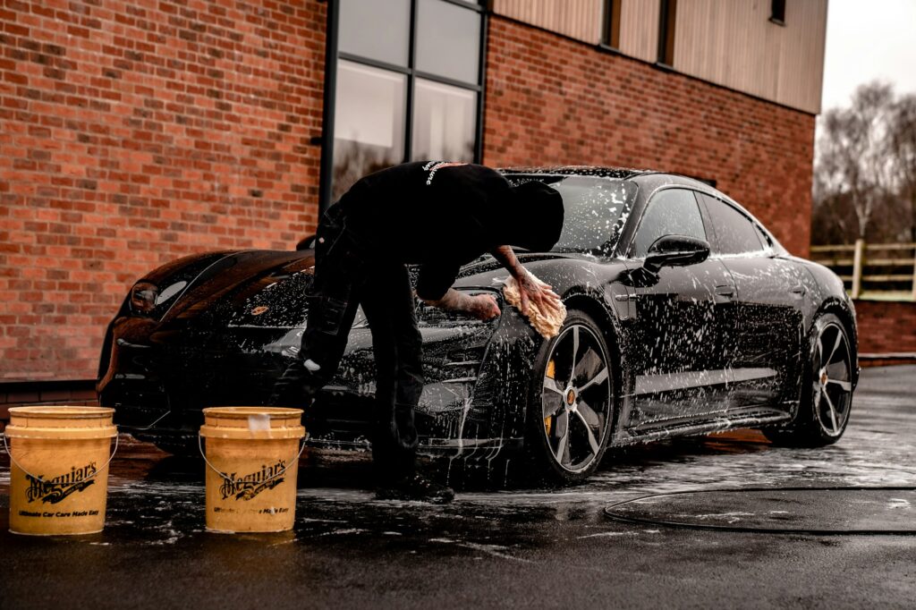 Unpopular Opinion: Is Car Detailing Making You Anxious to Drive? 2 man washing black car